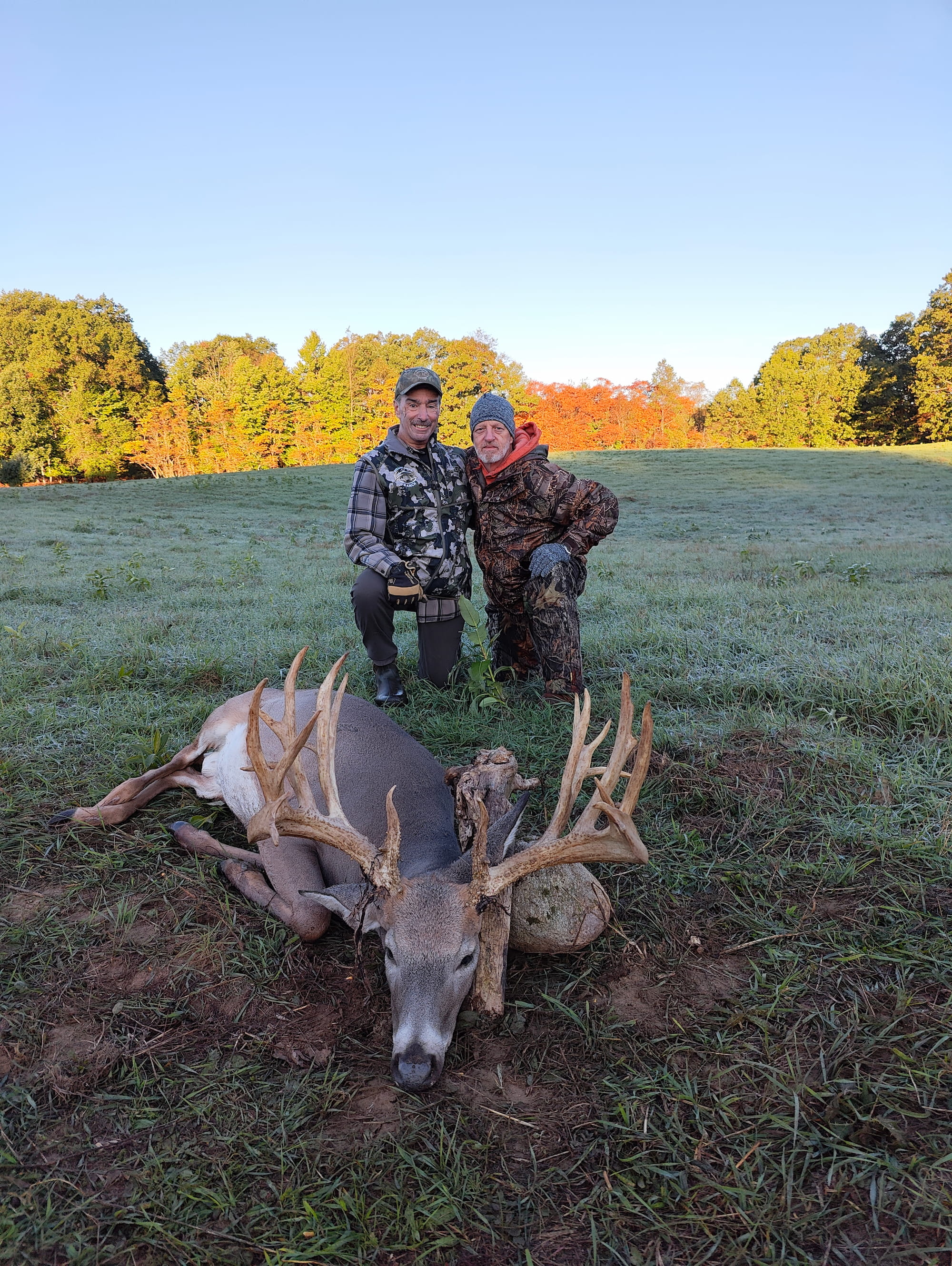 Hunter with trophy whitetail buck at Rolling Ridge Ranch
