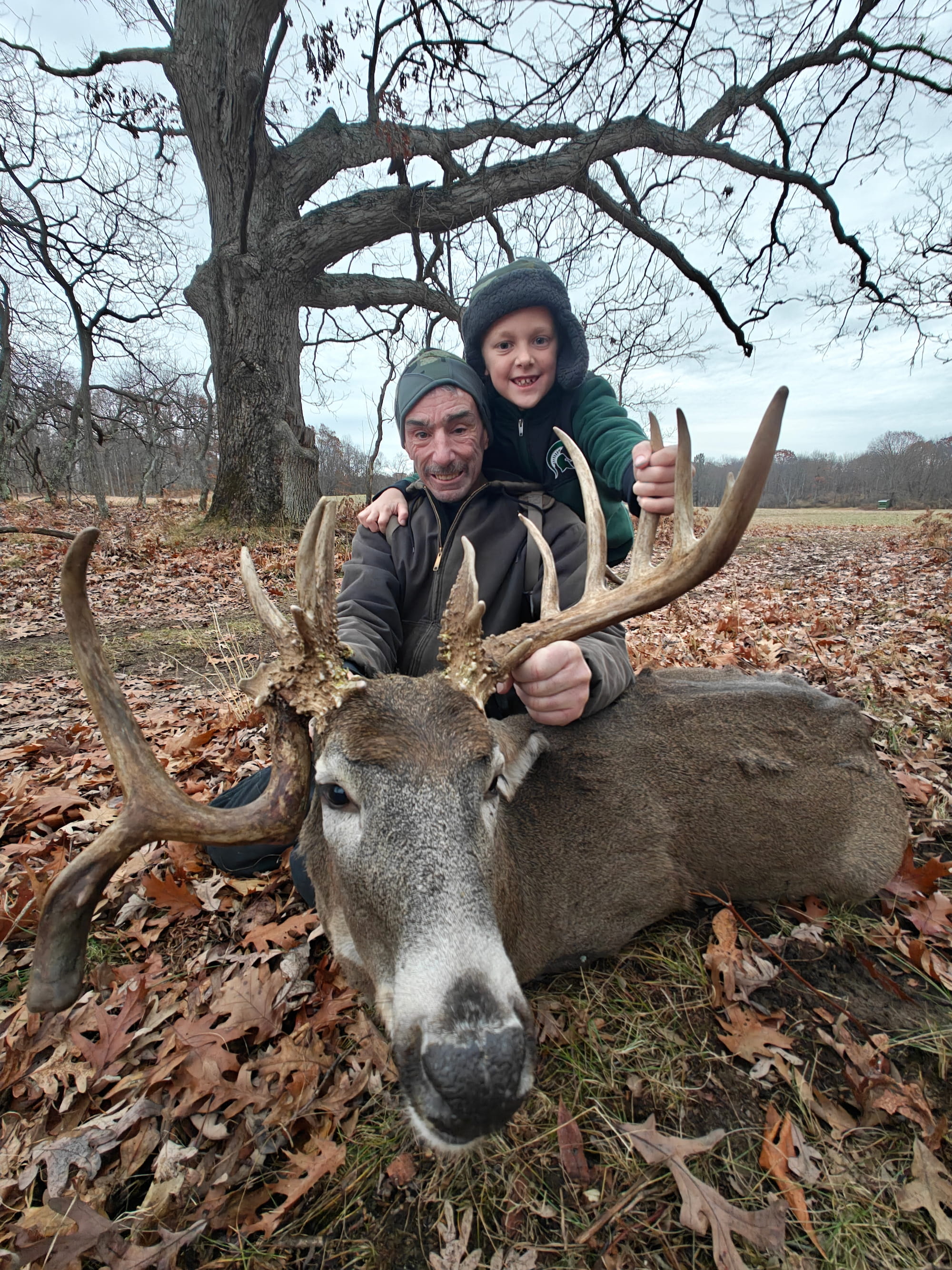 Father and son with a trophy whitetail at Rolling Ridge Ranch